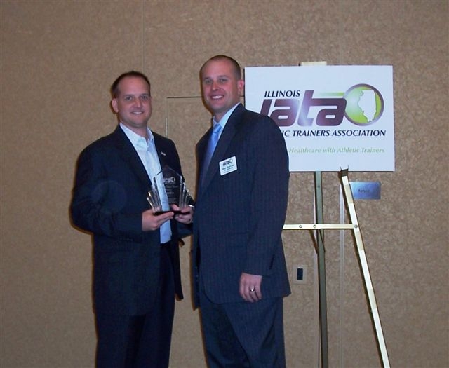 Jason Bannack accepts the 2009 Illinois Athletic Trainers Association Hospital/Clinic Award on behalf of AthletiCo.