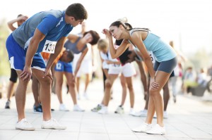 Exhausted marathon runners slow down their breathing to release stomach pain.