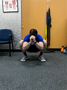 Squat with External Rotation Stretch