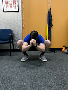 Squat with External Rotation Stretch